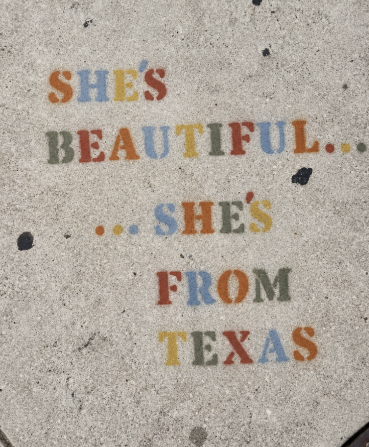 Colorful lettering reading She's beautiful, she's from Texas